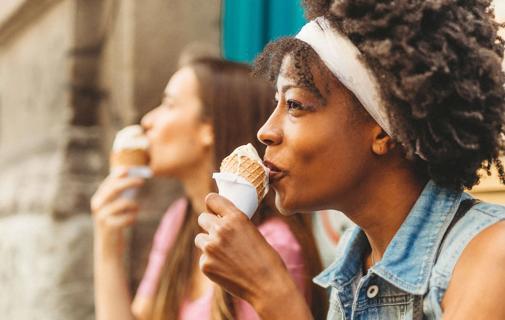 Two people enjoying ice cream cones