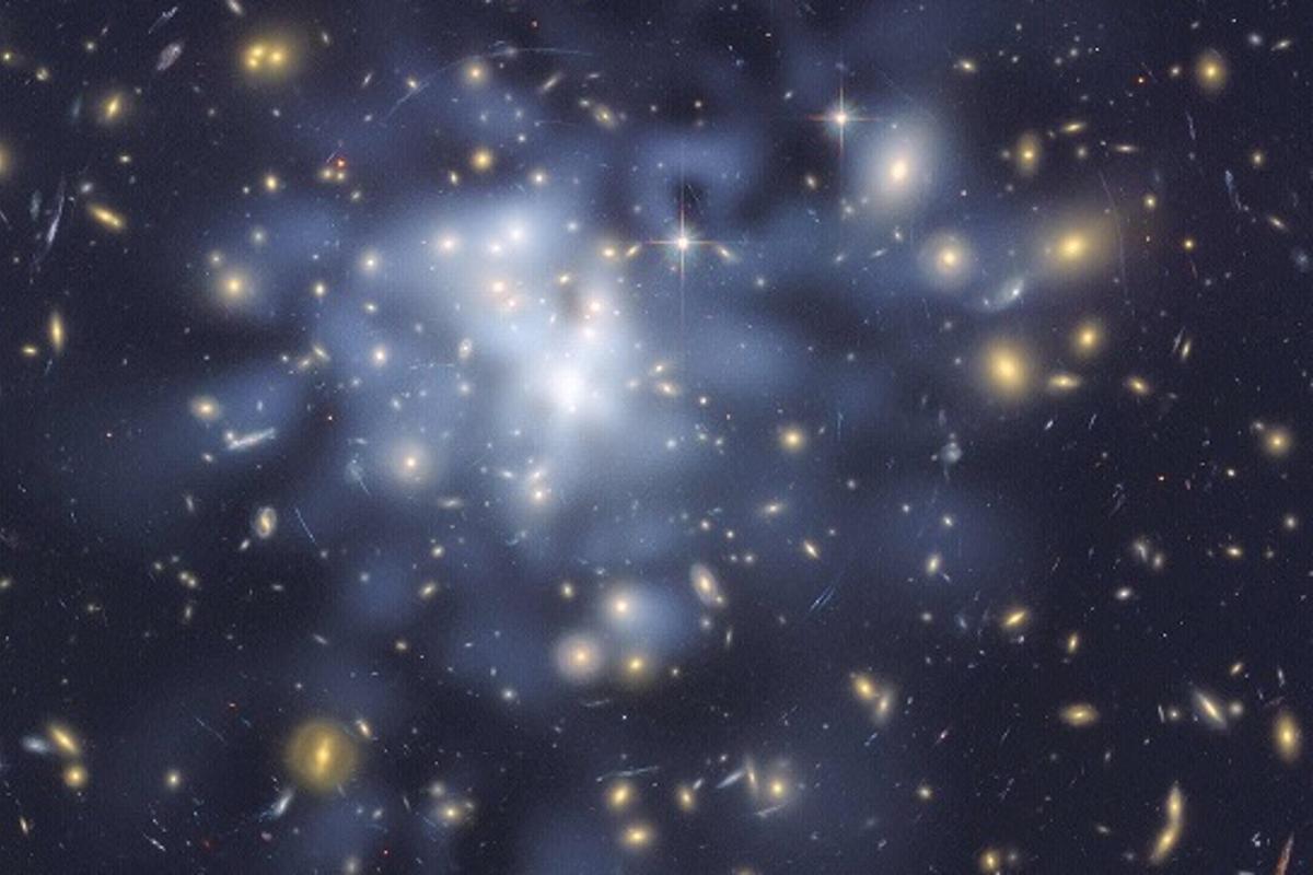 Scientists have proposed a new form of particle in dark matter theory (Photo: Abell 1689, a galaxy affected by gravitational lensing theorized to be amplified by dark matter. NASA JPL/Caltech and STScI)