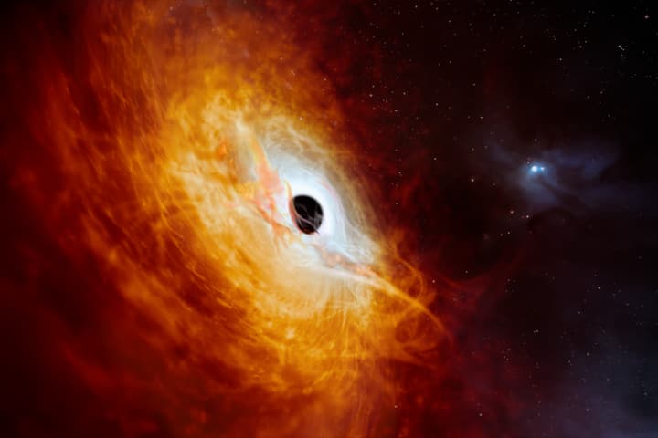 An artist's impression of the brightest object ever discovered – a quasar that shines with the light of 500 trillion Suns – which is also the fastest growing black hole, eating the equivalent of a Sun a day