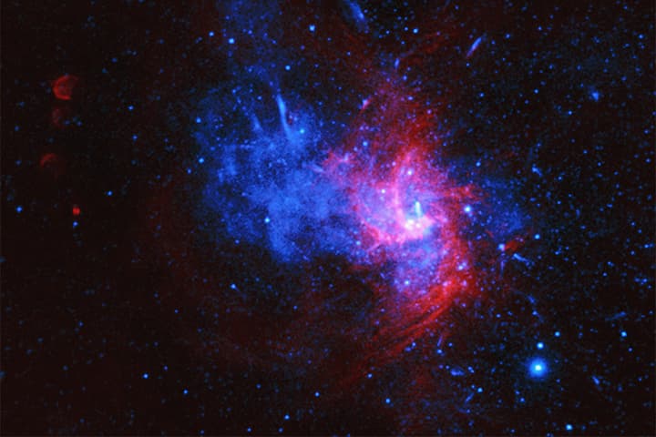 A composite image of the center of the Milky Way. The supermassive black hole, Sagittarius A*, is in the bright region at center-right