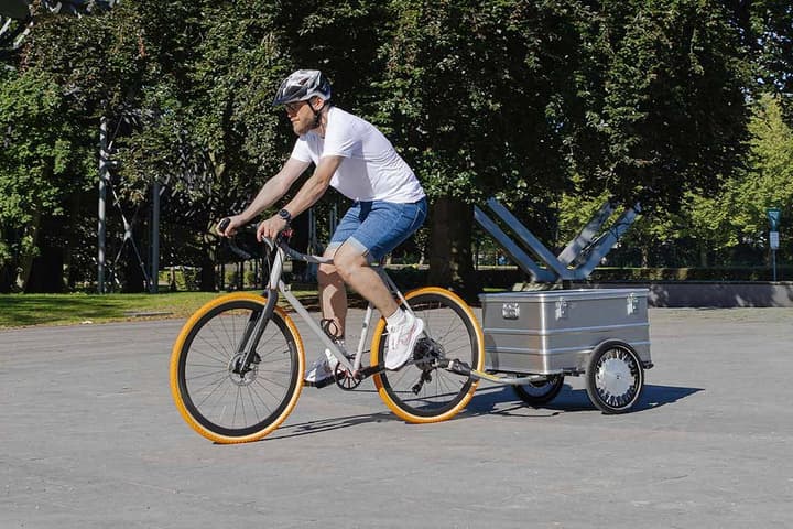 The Paxxter e trailer features two 125-W hub motors and a removable battery to help cancel out the extra load towed behind a bike