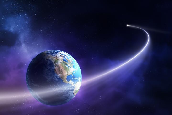 An artist's rendition of an asteroid swinging past Earth