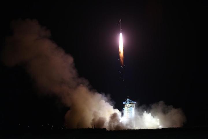 The QUESS satellite being launched on a Long March-2D rocket