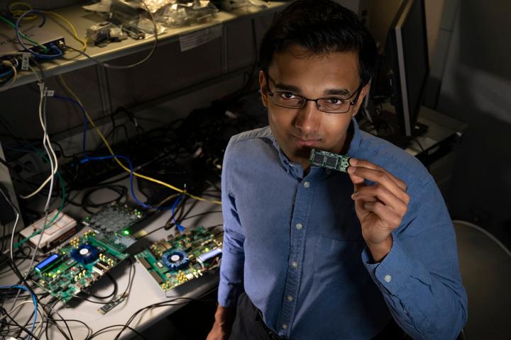 Intel Labs’ Nabil Imam holds a Loihi neuromorphic test chip in his Santa Clara, California, neuromorphic computing lab