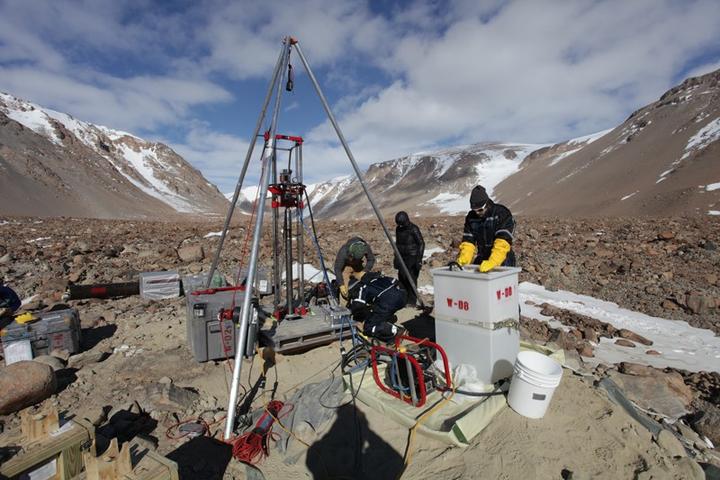 Researchers extract an ice core from Ong Valley, Antarctica