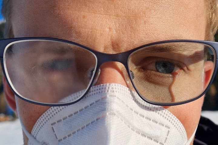 Along with its use on eyeglasses (lens at right), the coating could also be utilized on windows, mirrors or optical sensors