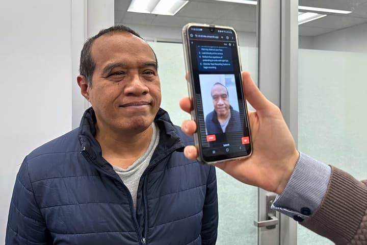 The smartphone tool is demonstrated on visiting associate professor Nemuel Daniel Pah