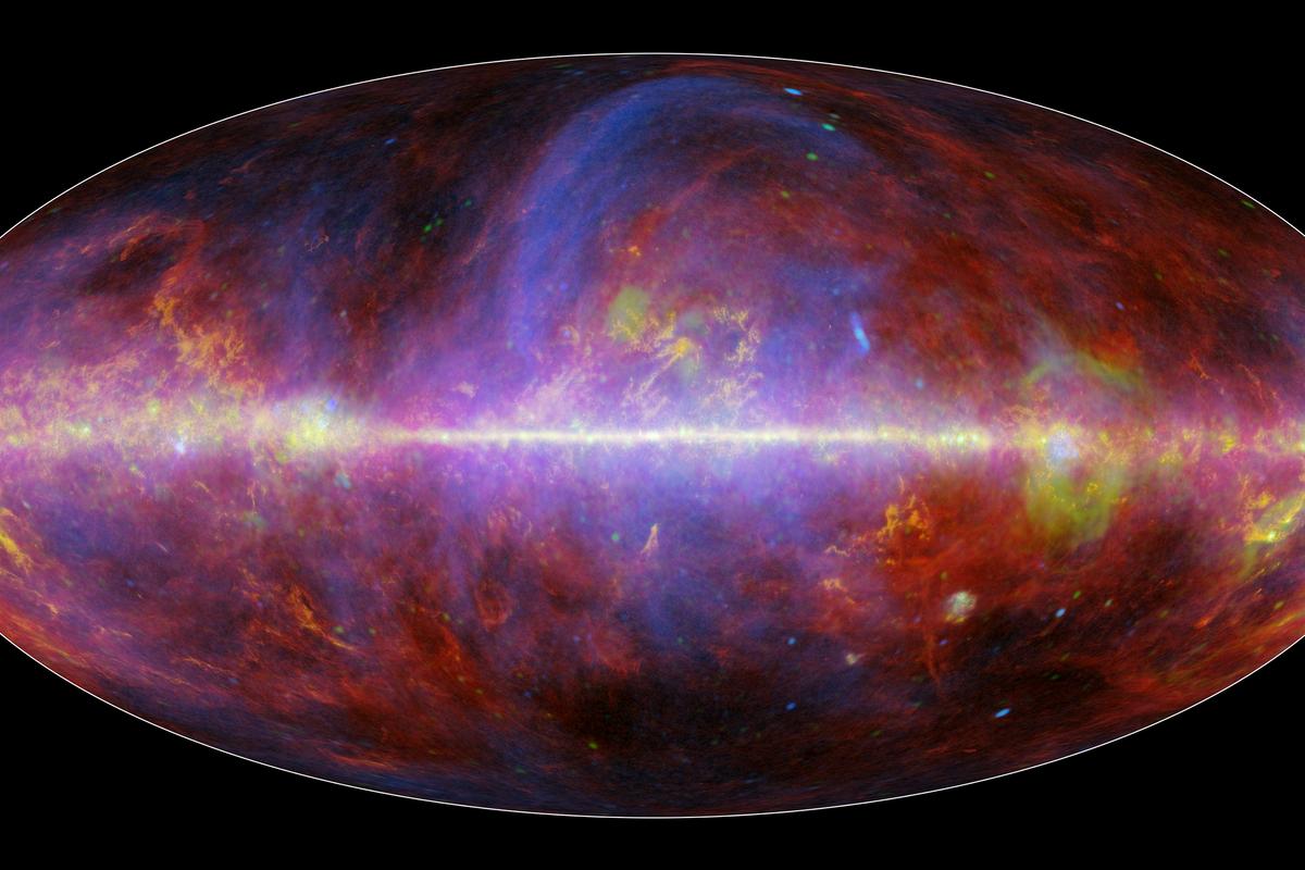 The new map from Planck, where blue areas indicate the presence of synchrotron radiation, the red is a form of dust that gives off a thermal glow, green represents free-free radiation and yellow indicates the presence of carbon monoxide gas (Image: ESA/NASA/JPL-Caltech)