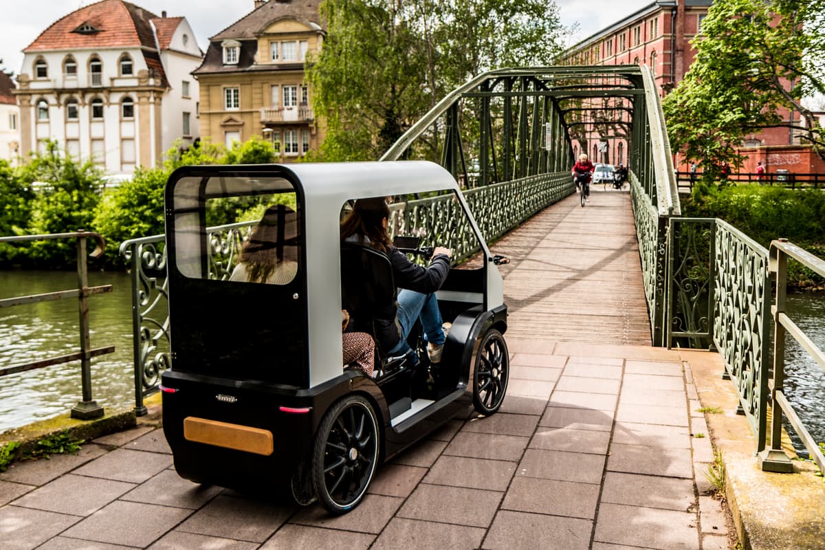 The Karbikes e-vehicle merges aspects of a micro-car and ebike, and benefits from greater visibility in traffic than a velomobile