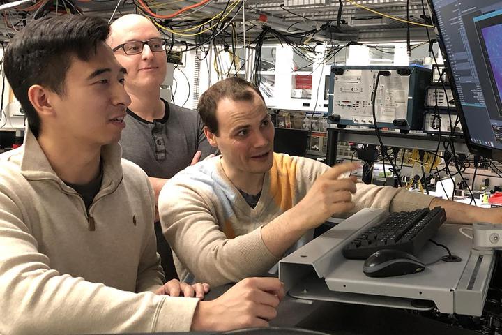 Graduate students Kevin Miao, Chris Anderson, and Alexandre Bourassa monitor quantum experiments at the Pritzker School of Molecular Engineering