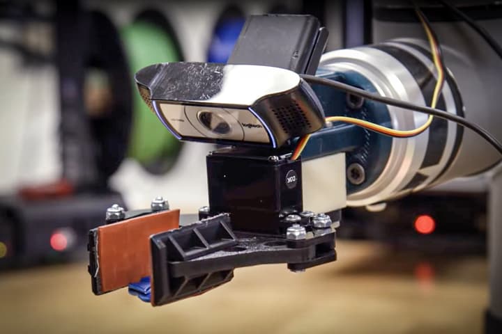 Boston University's autonomous AI robot gingerly discards it's latest plastic pancake