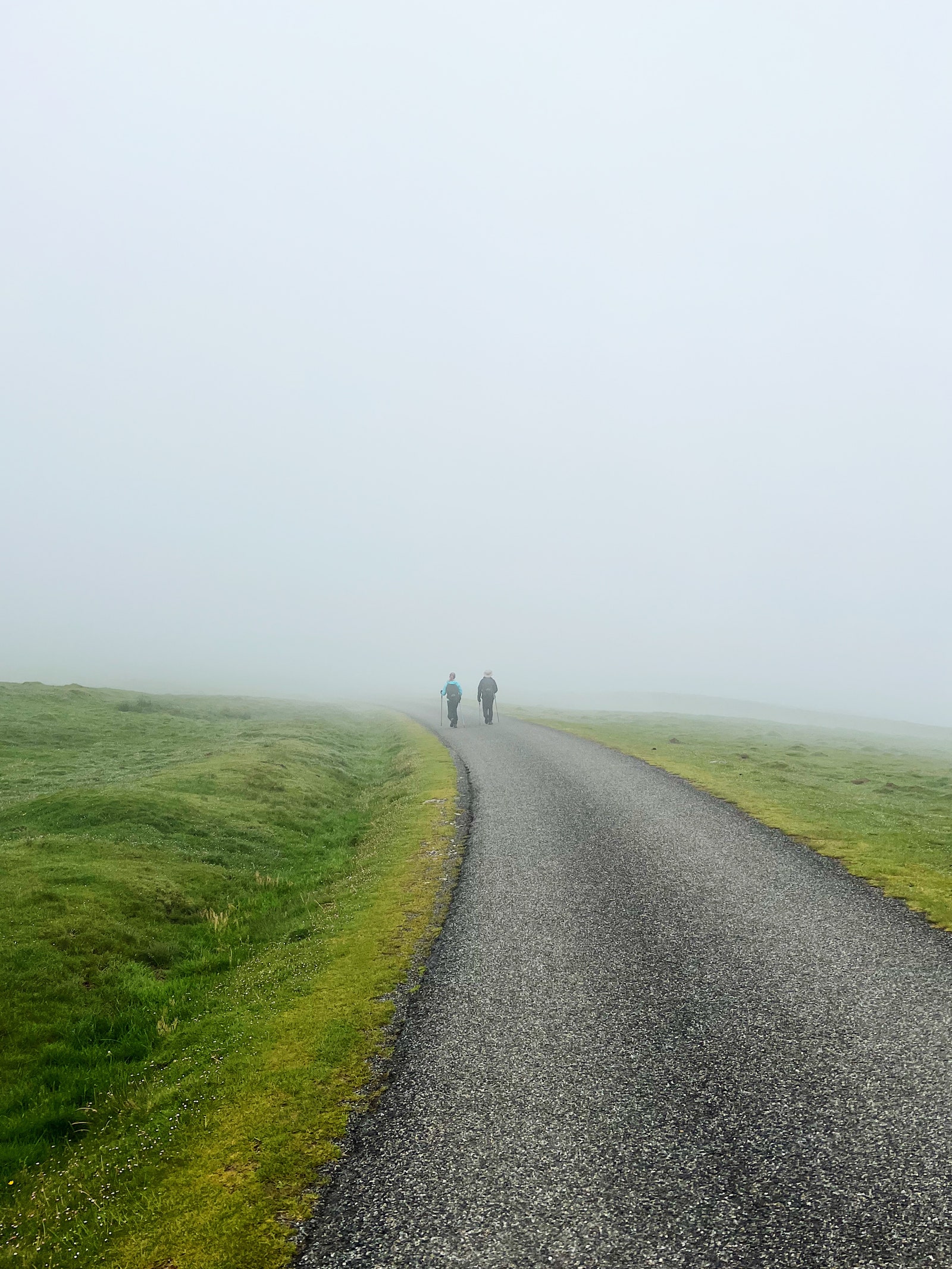 Image may contain Person Walking Road Horizon Nature Outdoors Sky Path Tarmac Weather Grass and Plant