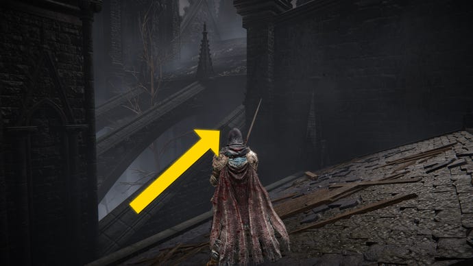 The player in Elden Ring: Shadow Of The Erdtree stands on a rooftop in the Church District and looks towards a series of nearby stone support struts.