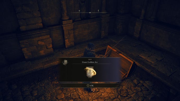 The player in Elden Ring: Shadow Of The Erdtree loots the Giant Golden Arc Incantation from a chest in the Ruins Of Unte.