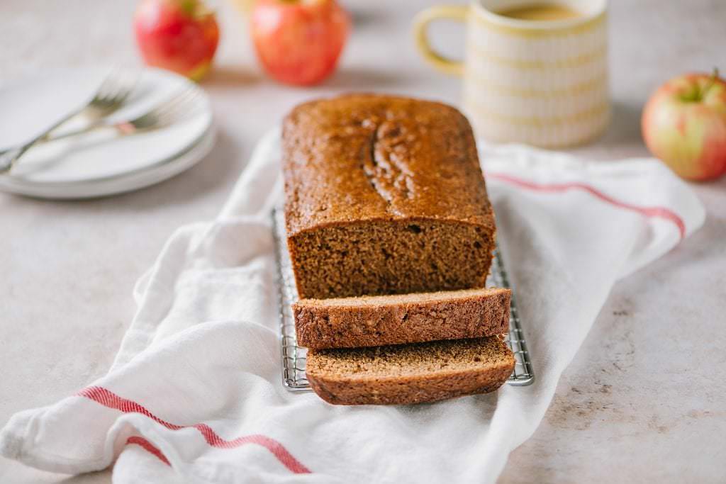 apple spice cake sliced on kitchen towel