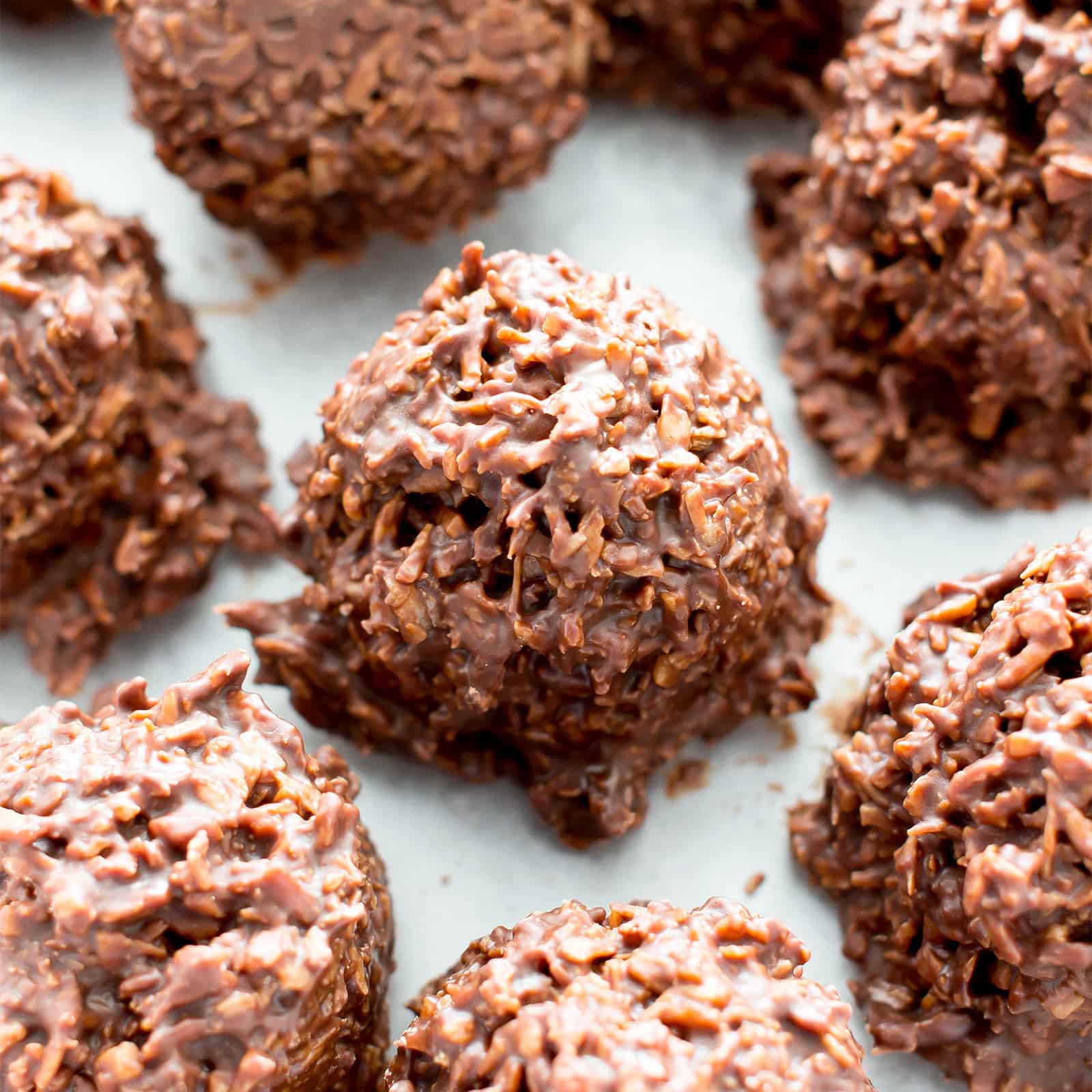 2 Ingredient Chocolate Coconut Candy Clusters: just 5 mins of prep for easy coconut chocolate clusters packed with chewy coconut flakes. The easiest chocolate coconut candy clusters! #Coconut #Chocolate #Candy #Clusters | Recipe at BeamingBaker.com