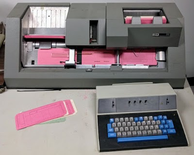 An IBM 029 keypunch in the middle of punching cards.