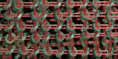 Detail of the core memory in the IBM 1401. Each toroidal ferrite core stores one bit.