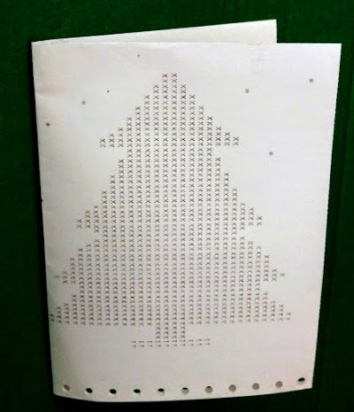 Closeup of a greeting card printed on the IBM 1401, with a Christmas tree on the front.