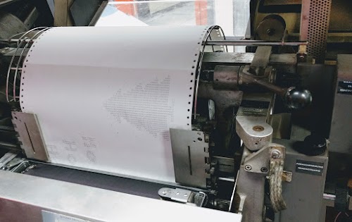 Printing a greeting card on the IBM 1403 line printer.