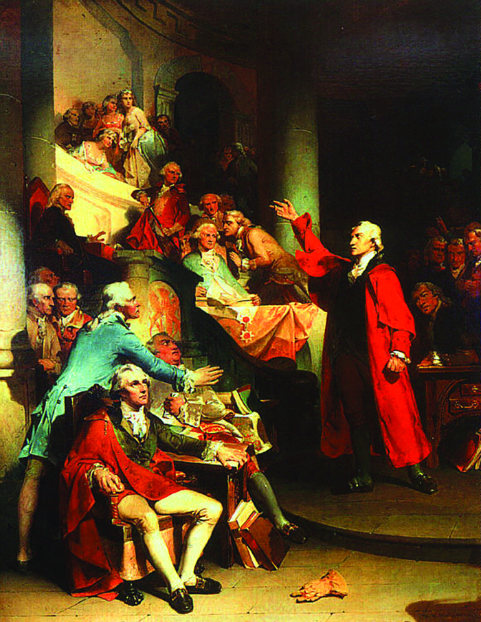 A painting shows Patrick Henry making a speech to a room full of well-dressed colonists. As Henry gestures dramatically with his arm, the members of his audience look on and whisper to one another.