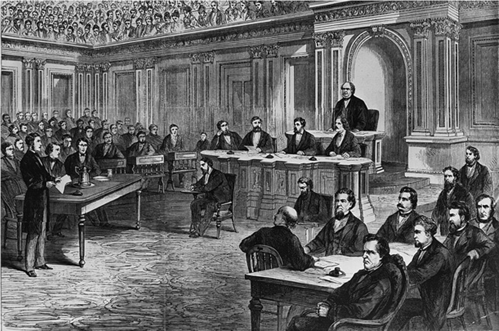 The figure shows a courtroom full of people. One man sits in a chair in the center of the courtroom while a man questions him.