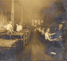 1906 composing room of the Atlanta Georgian depicting over a dozen men at various work stations