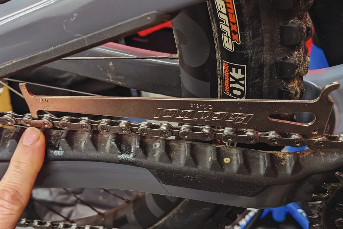 Chain checker tool on a mountain bike chain