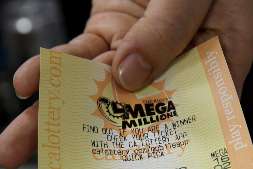 The Mega Millions jackpot has grown to more than $1 billion dollars, with a ticket shown from 168 Market in Hacienda Heights on Friday, Jan. 13, 2023.