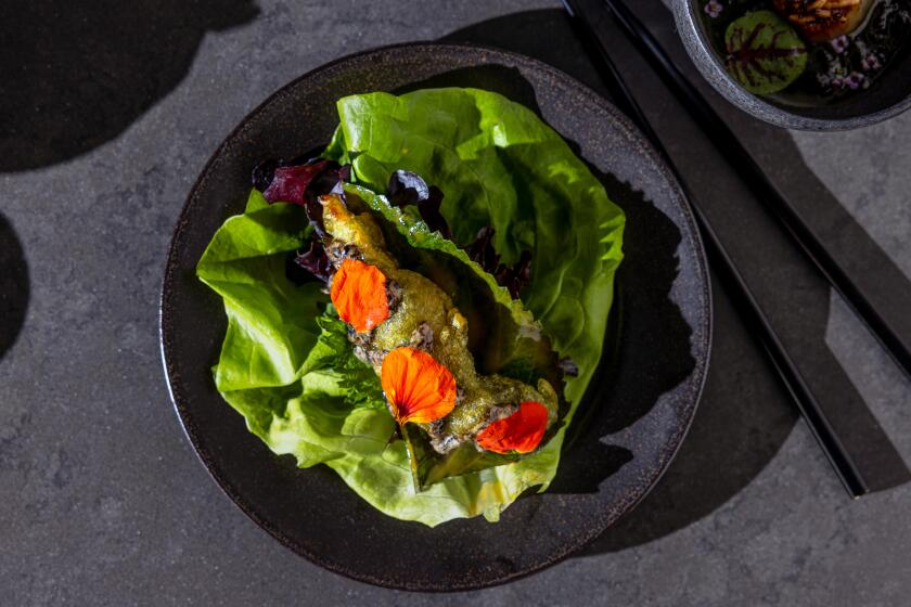 LOS ANGELES, CA - JANUARY 16, 2024: Baroo's Saeng (Life Begins), a course of parae (seaweed) battered sole, gim gochunaengi, gooseberry, and ssam photographed at the modern Korean restaurant in the Arts District neighborhood in downtown Los Angeles on Tuesday, Jan. 16, 2024. (Silvia Razgova / For The Times)