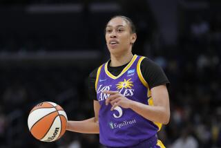 Los Angeles Sparks forward Dearica Hamby (5) controls the ball during a WNBA basketball game.