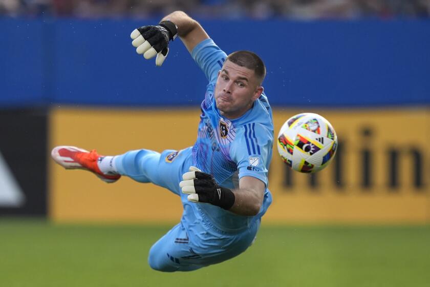 Los Angeles Galaxy goalkeeper John McCarthy watches a shot go wide during the first half.