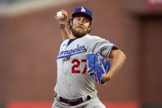 Dodgers pitcher Trevor Bauer throws against the San Francisco Giants.