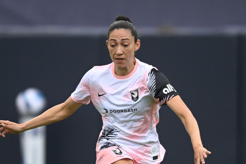 Angel City's Christen Press plays during an NWSL Challenge Cup soccer match against Wave FC, Saturday, April 2, 2022, in San Diego. (AP Photo/Denis Poroy)