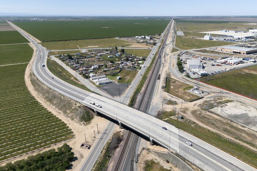 SHAFTER, CA- MARCH 20: Plans for the Wonderful Industrial Park, right, include expansion to the west, left; an inland port bringing in goods by rail from the Port of Los Angeles and sending out agriculture as well as a truck bypass road to keep traffic and emissions away from disadvantaged communities. The rail terminal would remove the equivalent of 240 diesel trucks from the roads. Photographed at Wonderful Industrial Park in Shafter, CA on Wednesday, March 20, 2024. (Myung J. Chun / Los Angeles Times)