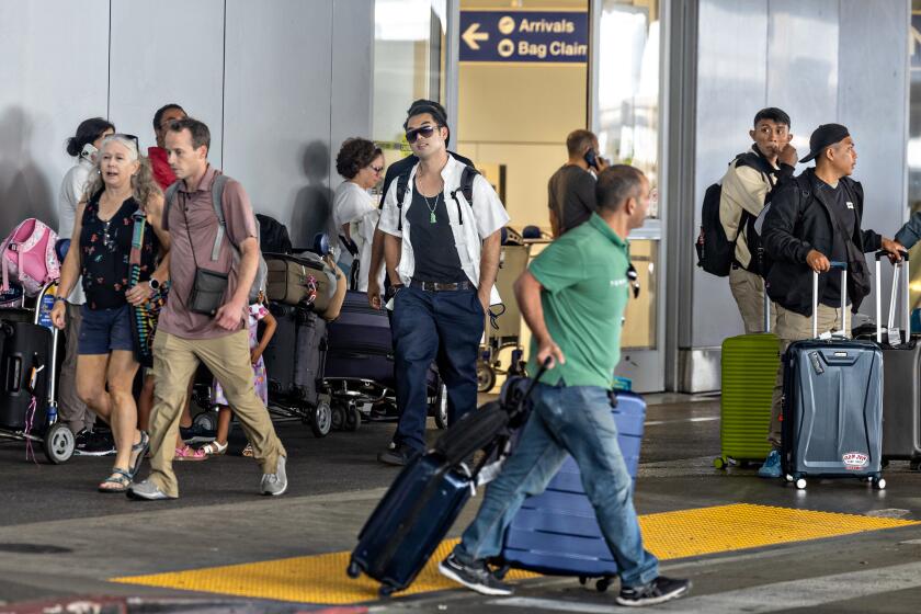 Los Angeles, CA - July 07: A large number of travelers make their way through Tom Bradley International Terminal at LAX, as a record amount of passengers pass through the airport today wrapping up a busy July 4th holiday on Sunday, July 7, 2024 in Los Angeles, CA. (Jason Armond / Los Angeles Times)