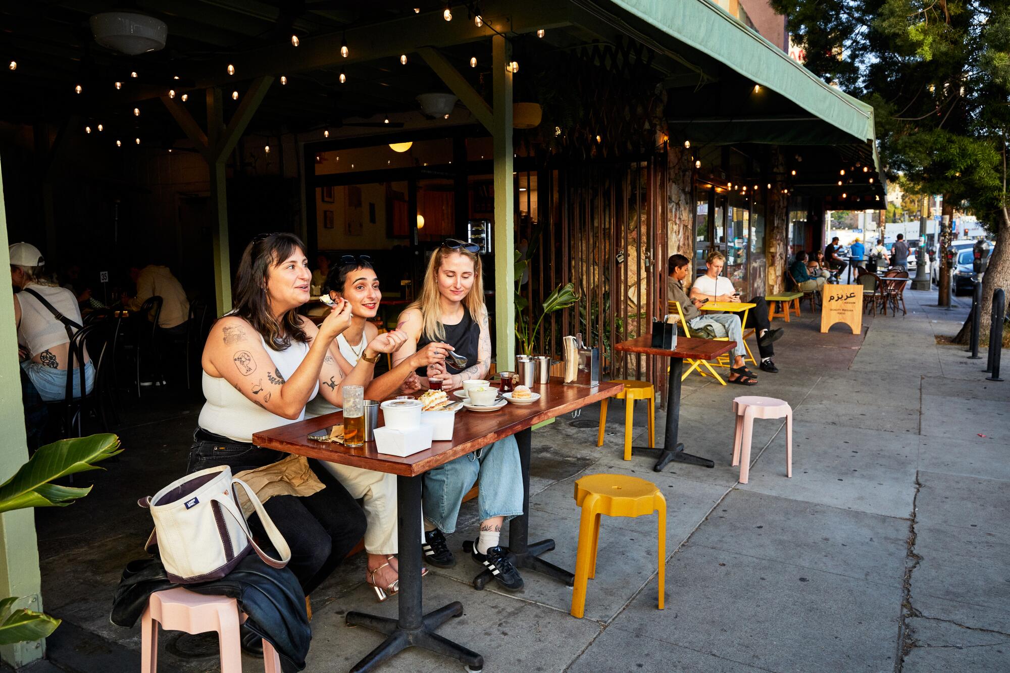 Enter through the outdoor patio, where diners take in the view of Sunset Boulevard and sip house-made shrubs and spritzes.