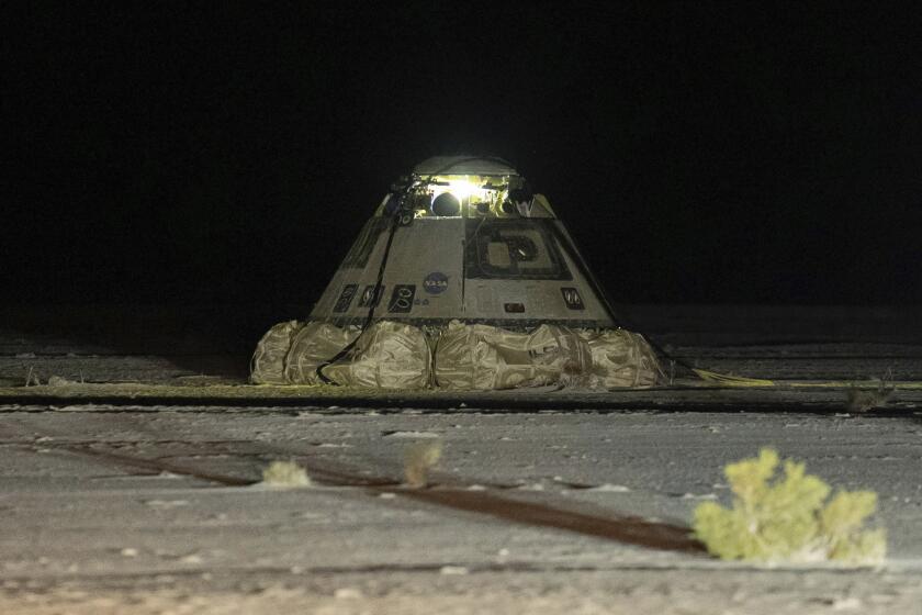 The empty Boeing Starliner capsule sits at White Sands Missile Range in New Mexico, late Friday, Sept. 6, 2024, after undocking from the International Space Station. (Boeing via AP)