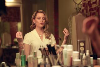 A woman sits at her mirror, meditating.