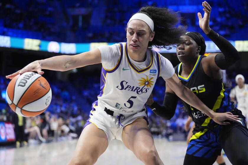 Los Angeles Sparks forward Dearica Hamby (5) tries to keep the ball away.