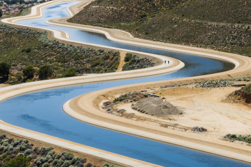 PALMDALE, CA - MAY 15: The California Aqueduct presented an inviting walk on a warm sunny day in Palmdale, CA on Wednesday, May 15, 2024. (Myung J. Chun / Los Angeles Times)