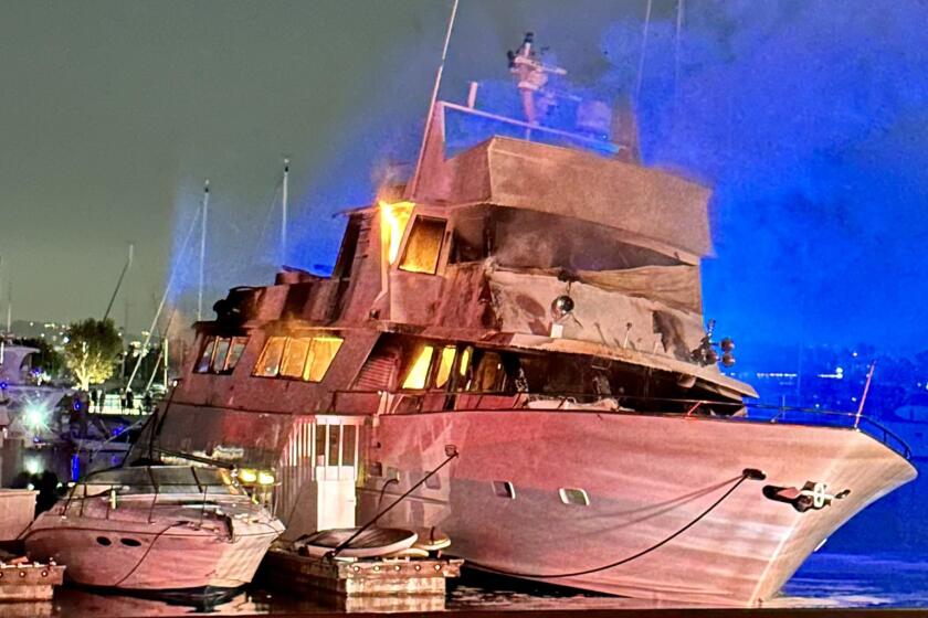 Fire stemming from a fireworks explosion on board a luxury yacht that sank while anchored in Marina del Rey.