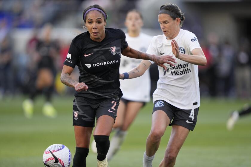 Angel City FC's Sydney Leroux dribbles past Bay FC's Emily Menges 