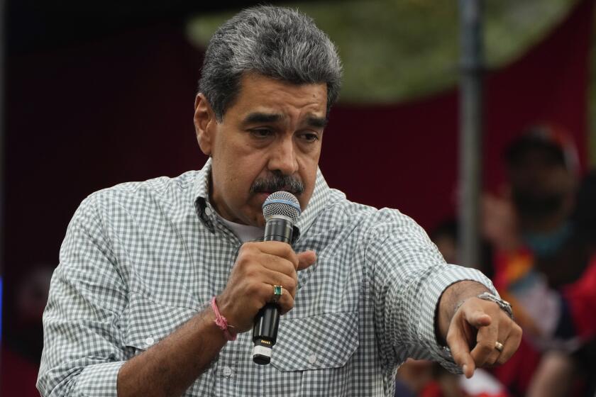 Venezuela's President Nicolas Maduro addresses government loyalists gathered at the presidential palace in support of his reelection one month after the presidential vote, in Caracas, Venezuela, Wednesday, Aug. 28, 2024. (AP Photo/Ariana Cubillos)