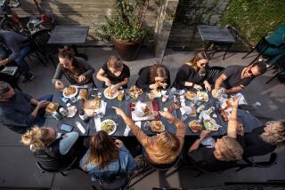 CULVER CITY, CA - November 19, 2021: People enjoy their lunch while eating in the back patio at Citizen Public Market, Culver City's newest food hall. (Mel Melcon / Los Angeles Times)