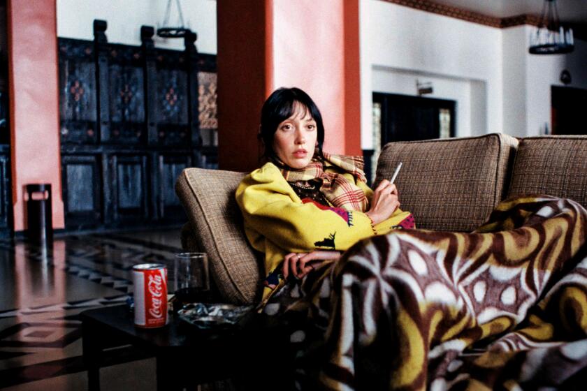 Wendy (Shelley Duvall) watches television in the Overlook Lobby in Stanley Kubrick's "The Shining."