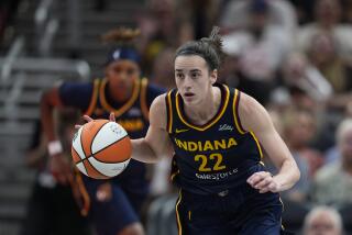 Indiana Fever's Caitlin Clark dribbles during the first half of a WNBA basketball game against the Seattle Storm, Sunday, Aug. 18, 2024, in Indianapolis. (AP Photo/Darron Cummings)