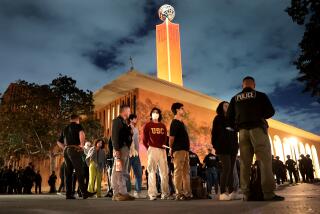 LOS ANGELES, CALIFORNIA - APRIL 24: Protestors are detained by LAPD officers who were trying to clear the USC campus during a demonstration against the war in in Gaza Wednesday. (Wally Skalij/Los Angeles Times)