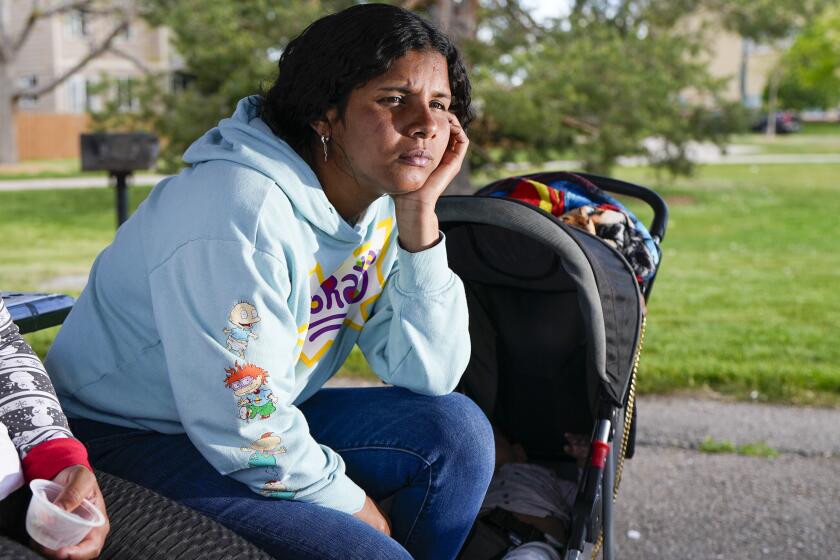 Ivanni Herrera looks on during an interview in a park Friday, May 18, 2024, in Aurora, Colo. (AP Photo/Jack Dempsey)