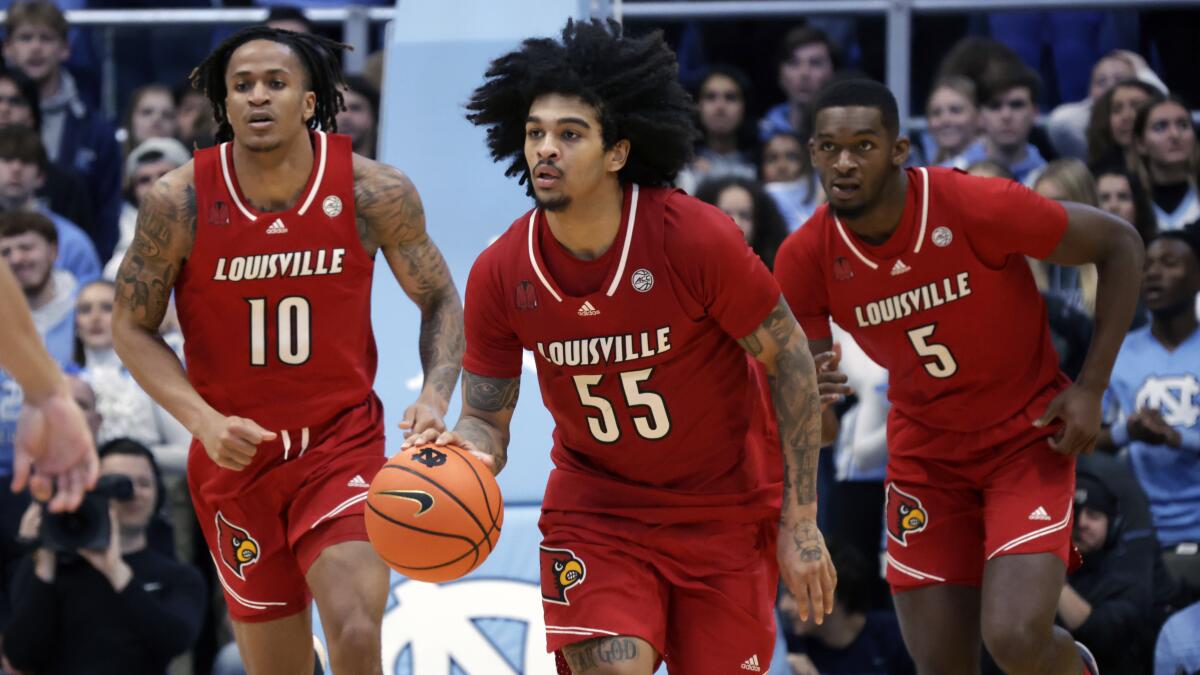 Louisville guard Skyy Clark controls the ball during a game against North Carolina in January.